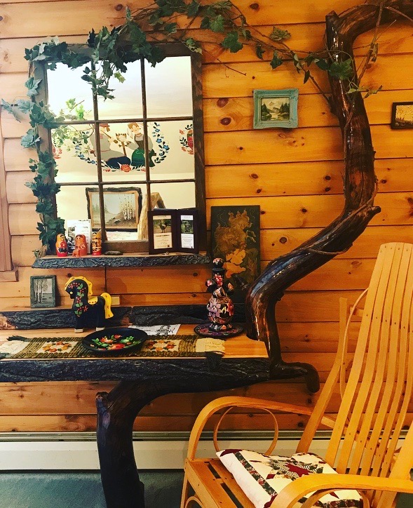 mirror with decorative log and amish rocking chair